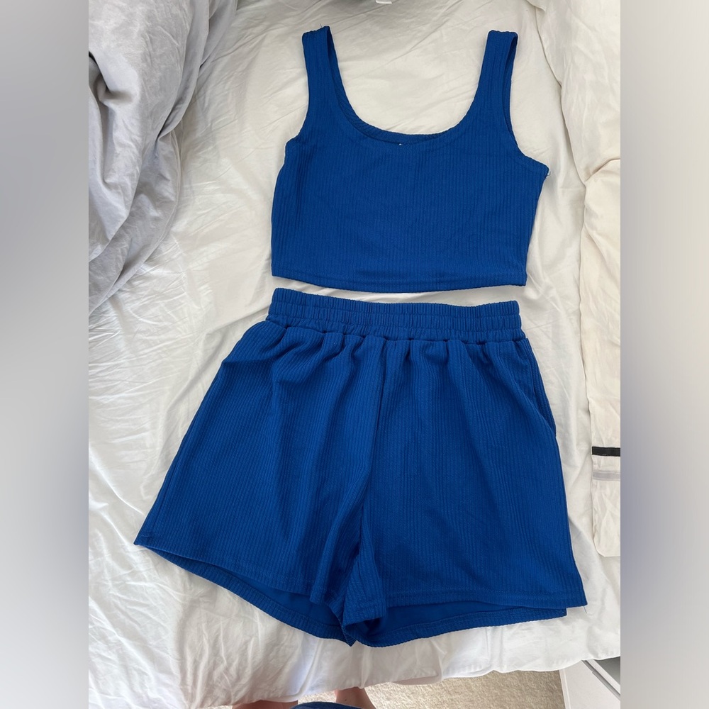 Blue athletic material tank and shorts set